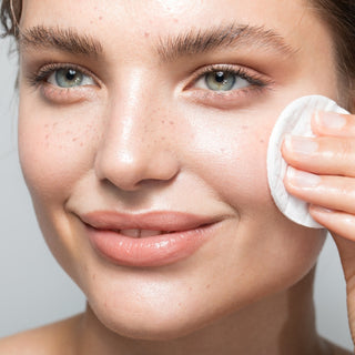 woman using RADIAN-C+ Antioxidant Brightening Essence