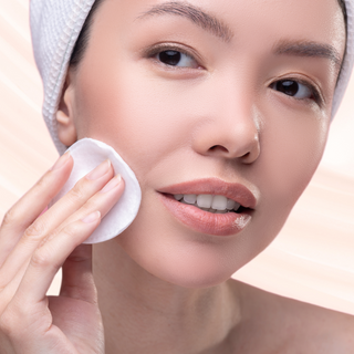 woman using AZURIEN Clarifying Beauty Renewal Essence