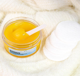 opened jar of BIOMAZE Gentle Microdermabrasion Balm to Milk Cleanser