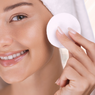 woman using ENAHANCE Essential Beauty Renewal Essence