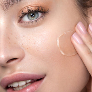 WOMAN applying La Nouvel Cellular Nutri Serum to her face