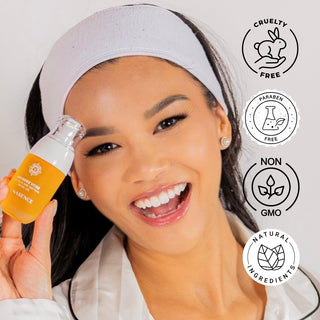 woman holding bottle of Orchidee Vitae Precious Age Defying Facial Oil