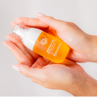 hands holding a bottle of Orchidee Vitae Precious Age Defying Facial Oil