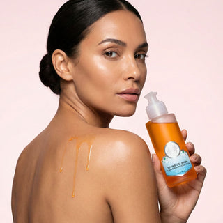 pretty woman is using divine delirium body oil