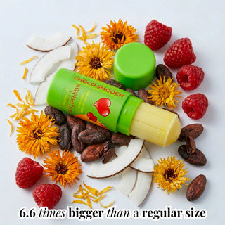 Green lip balm with a heart design surrounded by fruits, nuts, and flowers on a white background.