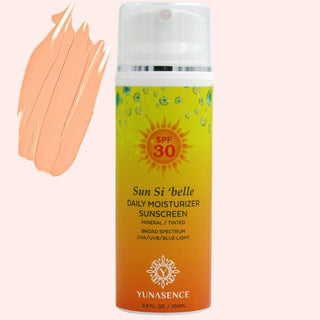 Sunscreen bottle with yellow label and white cap on a light pink background