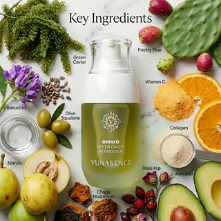 A bottle of YUNASENCE Omnio Green Cavi-R Retinolixir bottle on a white marble background, surrounded by labeled key ingredients including green caviar, prickly pear, vitamin C, collagen, rose hip, avocado, chaga mushroom, marula, olive squalene, bakuchiol, and green tea. Text at the top reads 'Key Ingredients'.