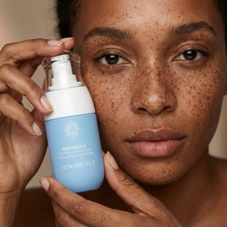 image of a woman holding Proface-c serum