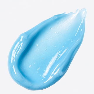 A glossy, smooth smear of light blue cosmetic cream or gel on a clean white background.