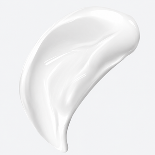 A glossy, thick white cream or lotion swatch swirled on a clean, light gray background.